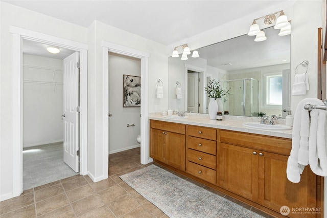 3419 NE Meadow Way, Issaquah, WA 98029 - bathroom with a shower stall, double vanity, and a spacious closet