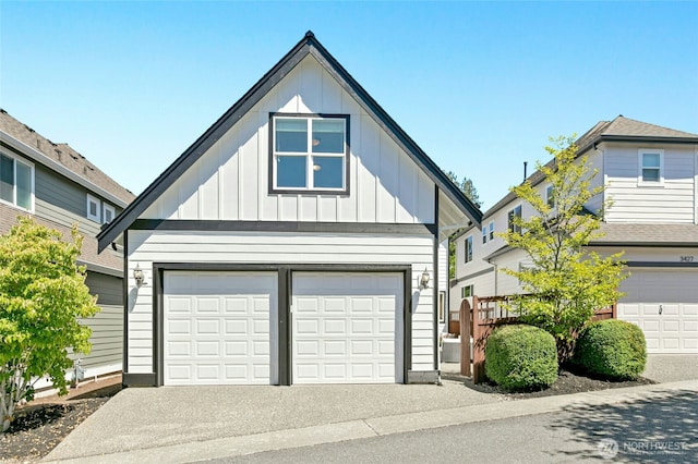 3419 NE Meadow Way, Issaquah, WA 98029 - view of front of property with board and batten siding, an attached garage, and driveway