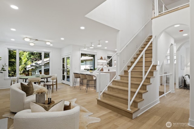 4043 55th Ave SW, Seattle, WA 98116 - staircase with wood finished floors and recessed lighting