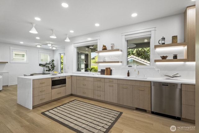 4043 55th Ave SW, Seattle, WA 98116 - kitchen with appliances with stainless steel finishes, open shelves, a peninsula, light countertops, and recessed lighting