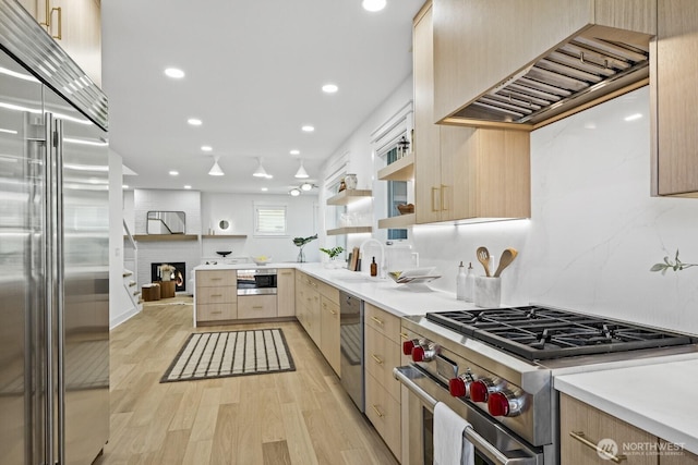 4043 55th Ave SW, Seattle, WA 98116 - kitchen with premium appliances, light brown cabinetry, modern cabinets, and recessed lighting