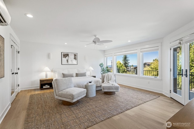 4043 55th Ave SW, Seattle, WA 98116 - bedroom featuring access to exterior, french doors, wood finished floors, an AC wall unit, and recessed lighting