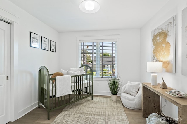 4043 55th Ave SW, Seattle, WA 98116 - bedroom with wood finished floors and a desk