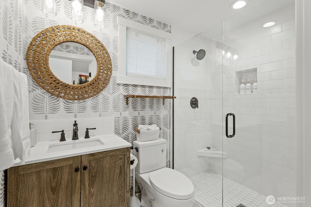 4043 55th Ave SW, Seattle, WA 98116 - bathroom featuring wallpapered walls, vanity, and a stall shower