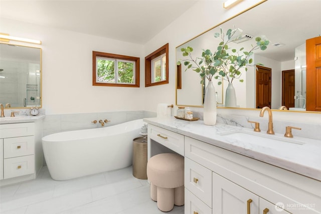 12407 Upper Preston Rd SE, Issaquah, WA 98027 - full bathroom with vanity, tile walls, a soaking tub, a stall shower, and a wainscoted wall