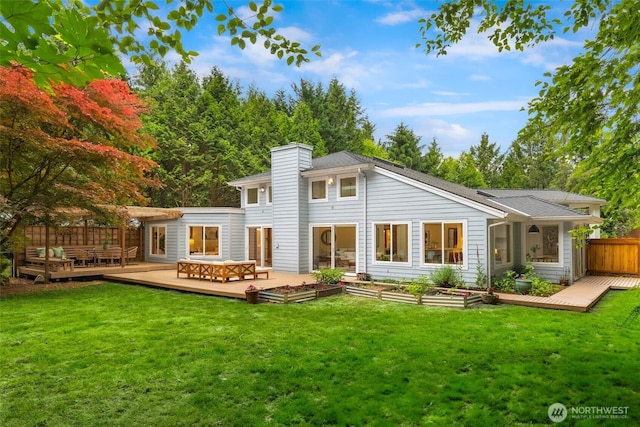 12407 Upper Preston Rd SE, Issaquah, WA 98027 - back of property with a deck, a vegetable garden, and a chimney
