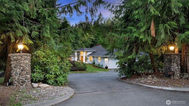 12407 Upper Preston Rd SE, Issaquah, WA 98027 - view of front facade featuring asphalt driveway and an attached garage