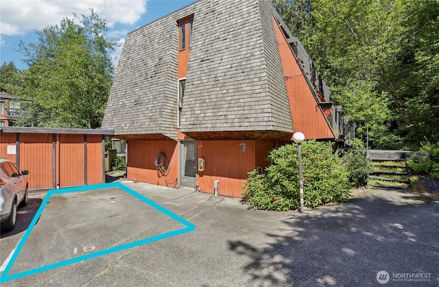 10765 Burke Ave N Unit 14, Seattle, WA 98133 - view of side of property featuring mansard roof