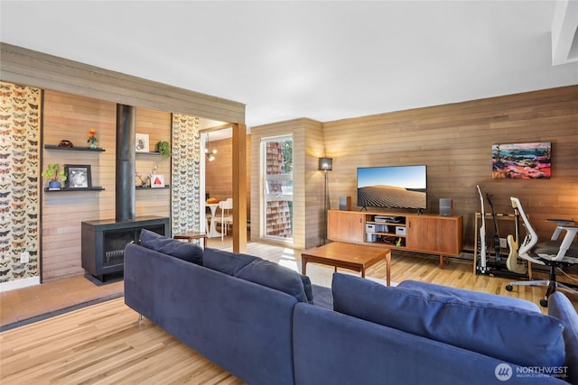 10765 Burke Ave N Unit 14, Seattle, WA 98133 - living room with wood walls, a wood stove, and wood finished floors
