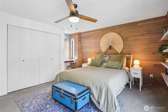 10765 Burke Ave N Unit 14, Seattle, WA 98133 - carpeted bedroom with wooden walls, a closet, and ceiling fan