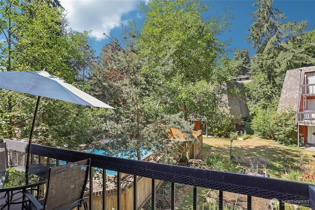 10765 Burke Ave N Unit 14, Seattle, WA 98133 - view of yard with a balcony and outdoor dining space