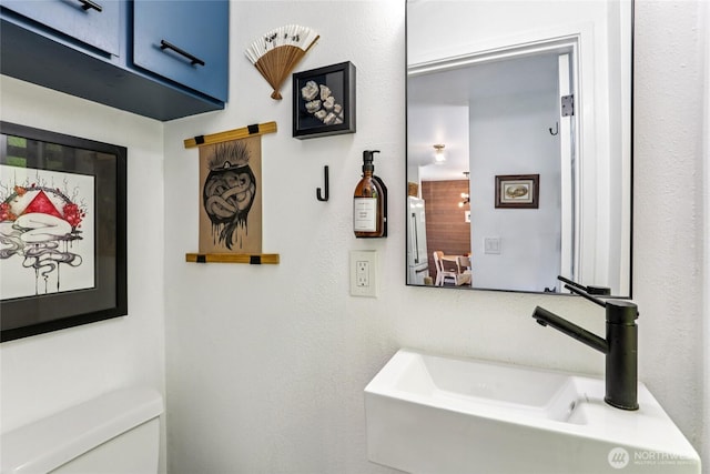 10765 Burke Ave N Unit 14, Seattle, WA 98133 - bathroom featuring toilet and a sink