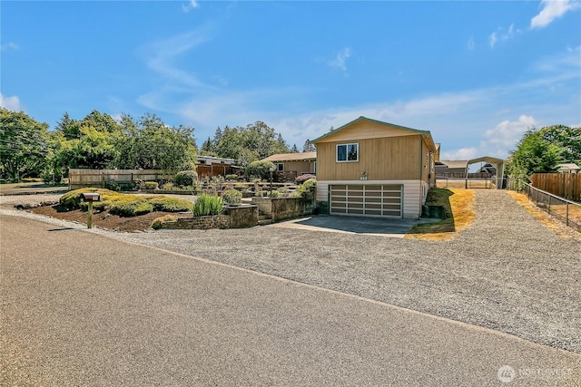 622 119th Ave E, Edgewood, WA 98372 - view of front of property featuring gravel driveway and a garage