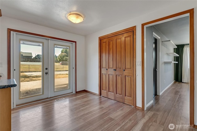 622 119th Ave E, Edgewood, WA 98372 - entrance foyer featuring french doors and light wood-style flooring