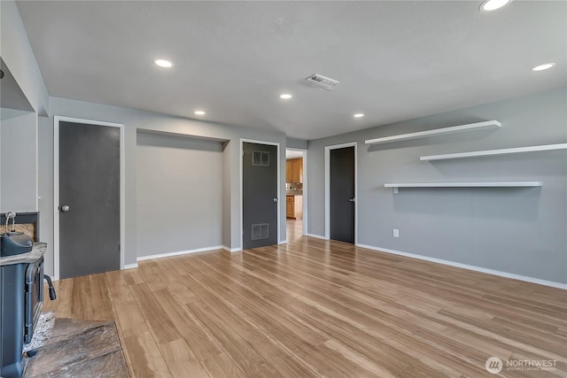 622 119th Ave E, Edgewood, WA 98372 - unfurnished living room featuring light wood finished floors and recessed lighting