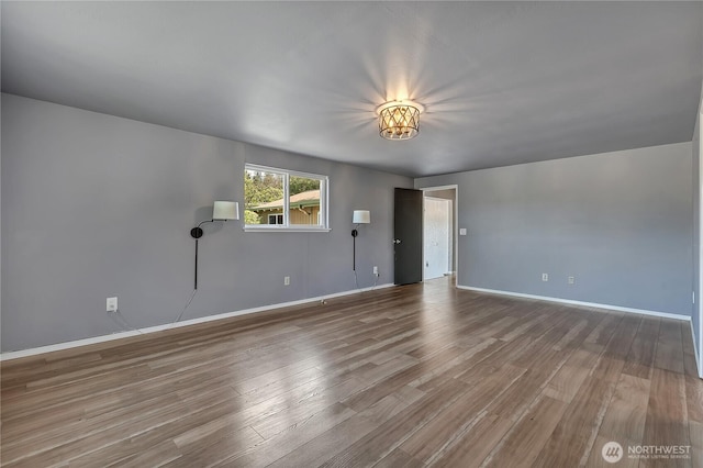 622 119th Ave E, Edgewood, WA 98372 - unfurnished living room with wood finished floors and baseboards