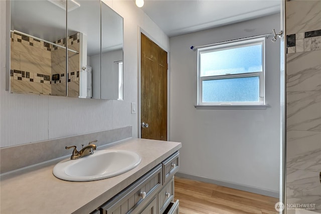 622 119th Ave E, Edgewood, WA 98372 - full bath with vanity, a marble finish shower, and wood finished floors