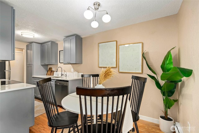 15749 NE 18th St Unit B5, Bellevue, WA 98008 - dining area featuring a textured ceiling and light wood-type flooring