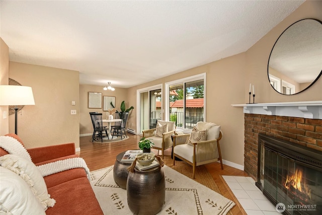 15749 NE 18th St Unit B5, Bellevue, WA 98008 - living area featuring a brick fireplace and wood finished floors