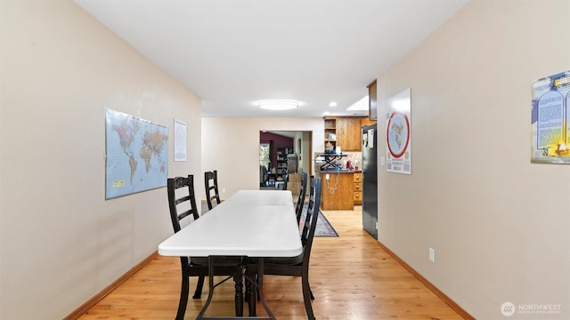 87 Sullivan Pl, Walla Walla, WA 99362 - dining area with light wood-style flooring and baseboards