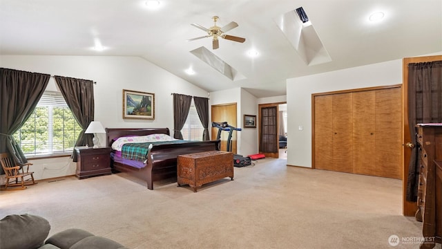 87 Sullivan Pl, Walla Walla, WA 99362 - bedroom featuring carpet floors, a skylight, vaulted ceiling, multiple closets, and ceiling fan