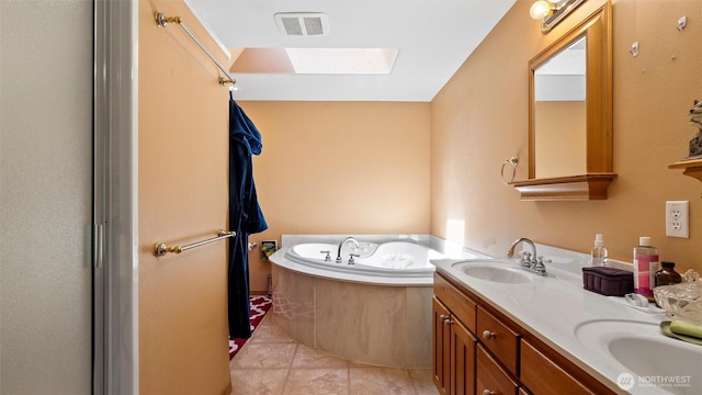 87 Sullivan Pl, Walla Walla, WA 99362 - full bath featuring a skylight, a garden tub, double vanity, and tile patterned flooring