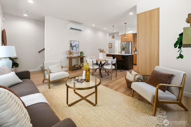 1746A NW 62nd St, Seattle, WA 98107 - living area with light wood-style floors, recessed lighting, and a wall unit AC