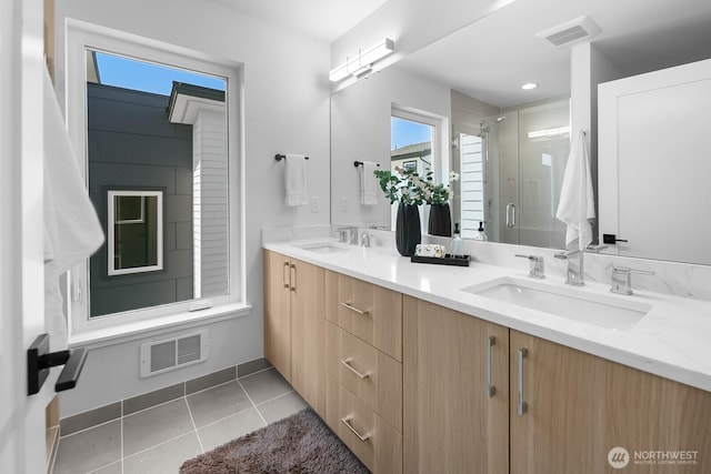 1746A NW 62nd St, Seattle, WA 98107 - bathroom with double vanity, a stall shower, and tile patterned floors