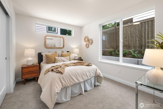 1746A NW 62nd St, Seattle, WA 98107 - bedroom with multiple windows, carpet, and a closet