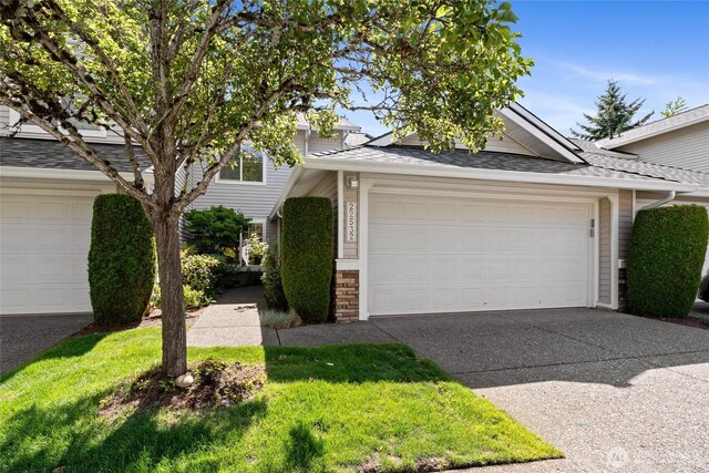 22532 43rd Ave S Unit 19-2, Kent, WA 98032 - view of front of property featuring concrete driveway, roof with shingles, and an attached garage