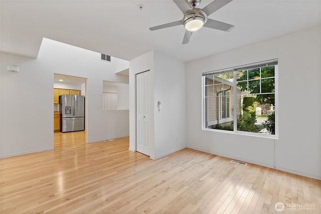 22532 43rd Ave S Unit 19-2, Kent, WA 98032 - empty room featuring light wood-style floors, fire sprinkler in ceiling, and ceiling fan