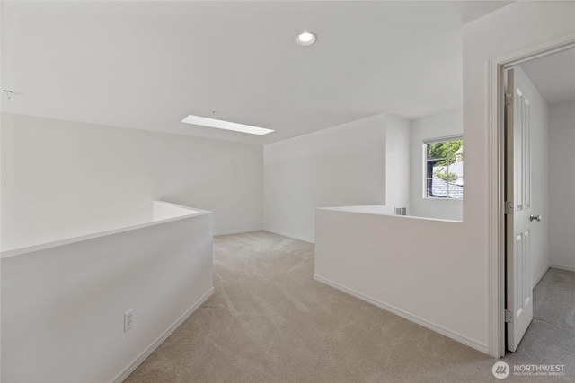 22532 43rd Ave S Unit 19-2, Kent, WA 98032 - hall featuring light colored carpet, recessed lighting, and a skylight