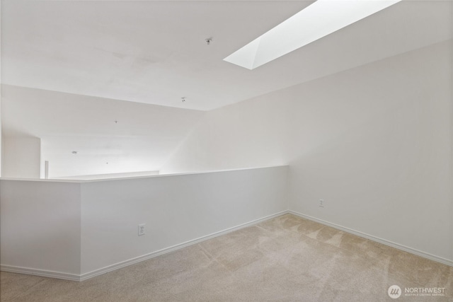 22532 43rd Ave S Unit 19-2, Kent, WA 98032 - carpeted spare room with a skylight, lofted ceiling, and fire sprinkler in ceiling