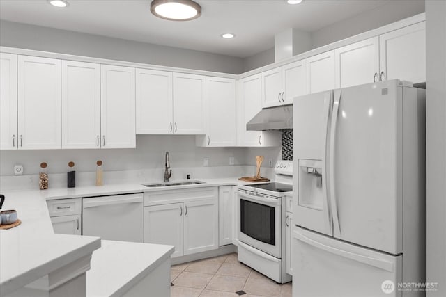 15000 Juanita Dr NE Unit 402, Kenmore, WA 98028 - kitchen with white appliances, under cabinet range hood, white cabinets, light countertops, and light tile patterned flooring