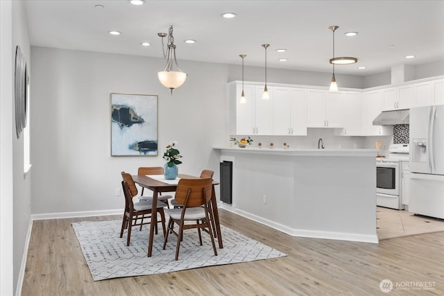 15000 Juanita Dr NE Unit 402, Kenmore, WA 98028 - dining room featuring light wood-type flooring and recessed lighting