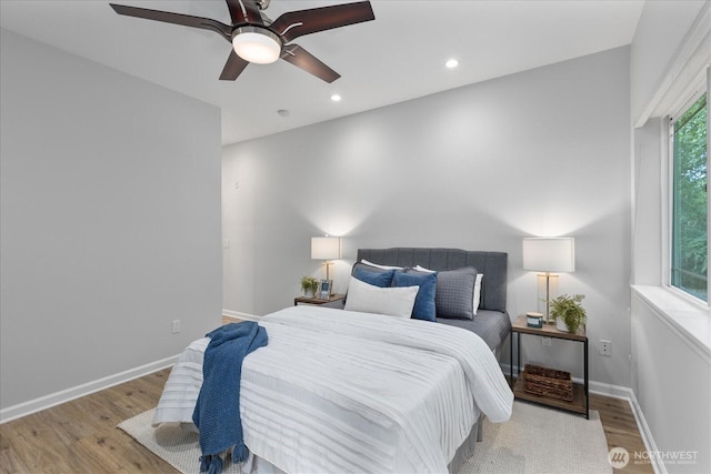 15000 Juanita Dr NE Unit 402, Kenmore, WA 98028 - bedroom featuring wood finished floors, a ceiling fan, and recessed lighting