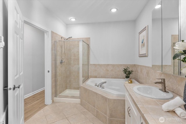 15000 Juanita Dr NE Unit 402, Kenmore, WA 98028 - full bath with a bath, a stall shower, tile patterned floors, vanity, and recessed lighting