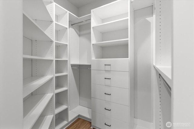 15000 Juanita Dr NE Unit 402, Kenmore, WA 98028 - walk in closet featuring wood finished floors