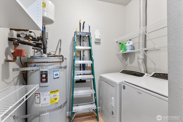 15000 Juanita Dr NE Unit 402, Kenmore, WA 98028 - washroom with secured water heater, washing machine and clothes dryer, and light wood-style floors