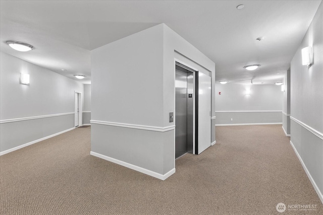 15000 Juanita Dr NE Unit 402, Kenmore, WA 98028 - hall featuring elevator and carpet flooring