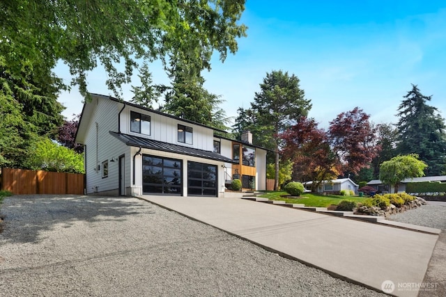 7502 117th Ave NE, Kirkland, WA 98033 - modern inspired farmhouse featuring driveway, a standing seam roof, a metal roof, a sunroom, and a chimney
