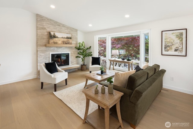 7502 117th Ave NE, Kirkland, WA 98033 - living area featuring a fireplace, light wood-style floors, lofted ceiling, and recessed lighting