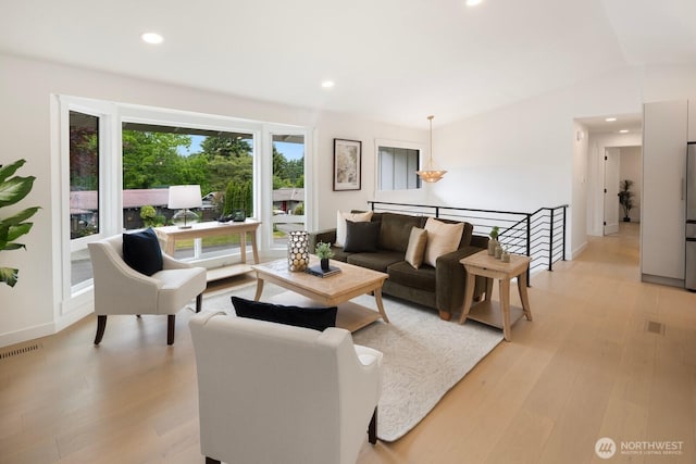 7502 117th Ave NE, Kirkland, WA 98033 - living room with recessed lighting and light wood-type flooring