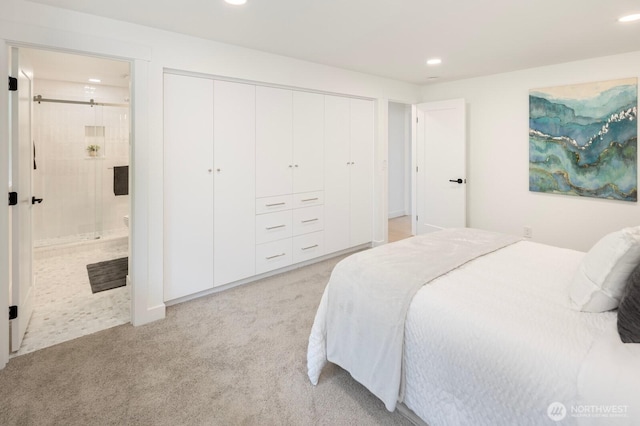 7502 117th Ave NE, Kirkland, WA 98033 - bedroom with recessed lighting, light carpet, ensuite bath, and a closet