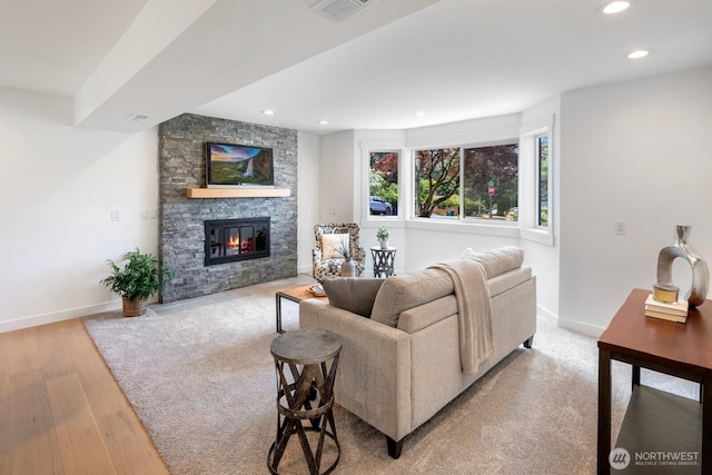 7502 117th Ave NE, Kirkland, WA 98033 - living area with recessed lighting, light wood-style flooring, and a stone fireplace