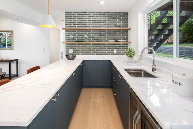 7502 117th Ave NE, Kirkland, WA 98033 - kitchen with open shelves, light wood-style floors, backsplash, plenty of natural light, and recessed lighting