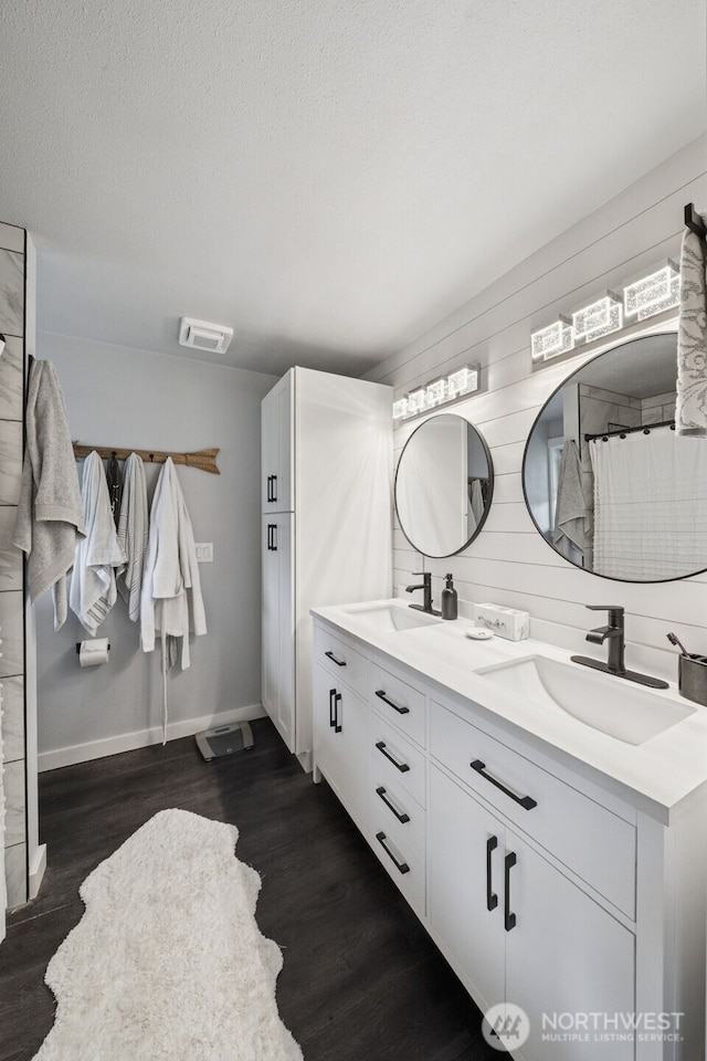 2010 Tacoma Rd, Puyallup, WA 98371 - bathroom featuring double vanity and wood finished floors