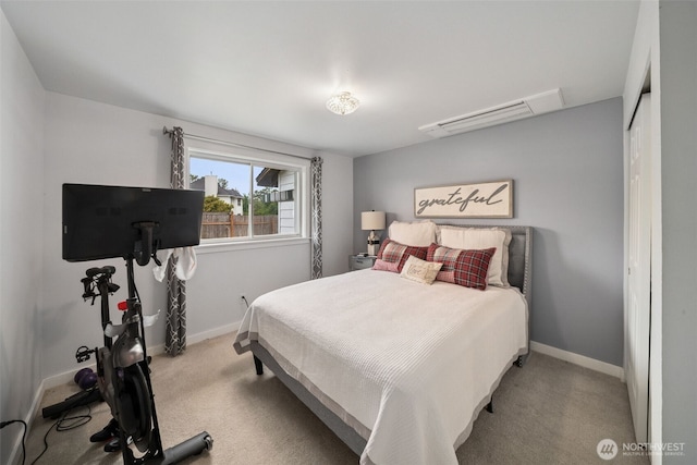 2010 Tacoma Rd, Puyallup, WA 98371 - carpeted bedroom featuring baseboards and a wall mounted AC