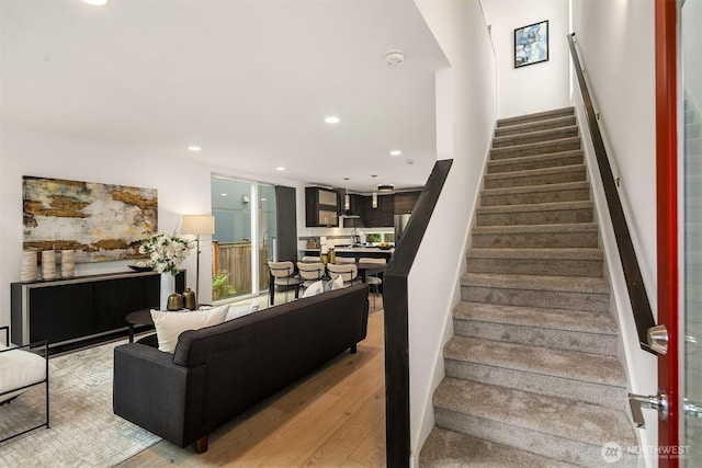 909 29th Ave S, Seattle, WA 98144 - stairs featuring wood finished floors and recessed lighting