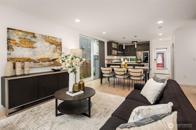 909 29th Ave S, Seattle, WA 98144 - living room featuring light wood-type flooring and recessed lighting